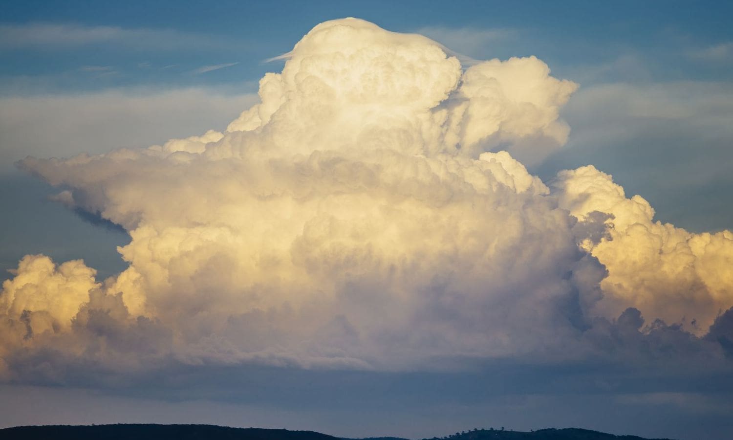 Storm Exit Maintains Clouds and Coolness