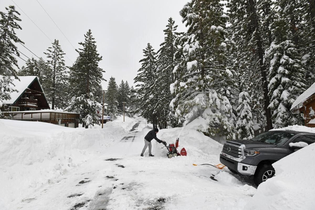 Workers Brave 10-Foot Snow Tunnel 